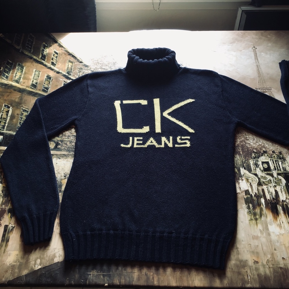 Navy CK sweater with pale yellow writing
